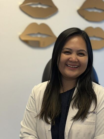 Bianca Camille Fong, APRN, FNP-BC, owner of Blanqa Medspa, in a white lab coat.
