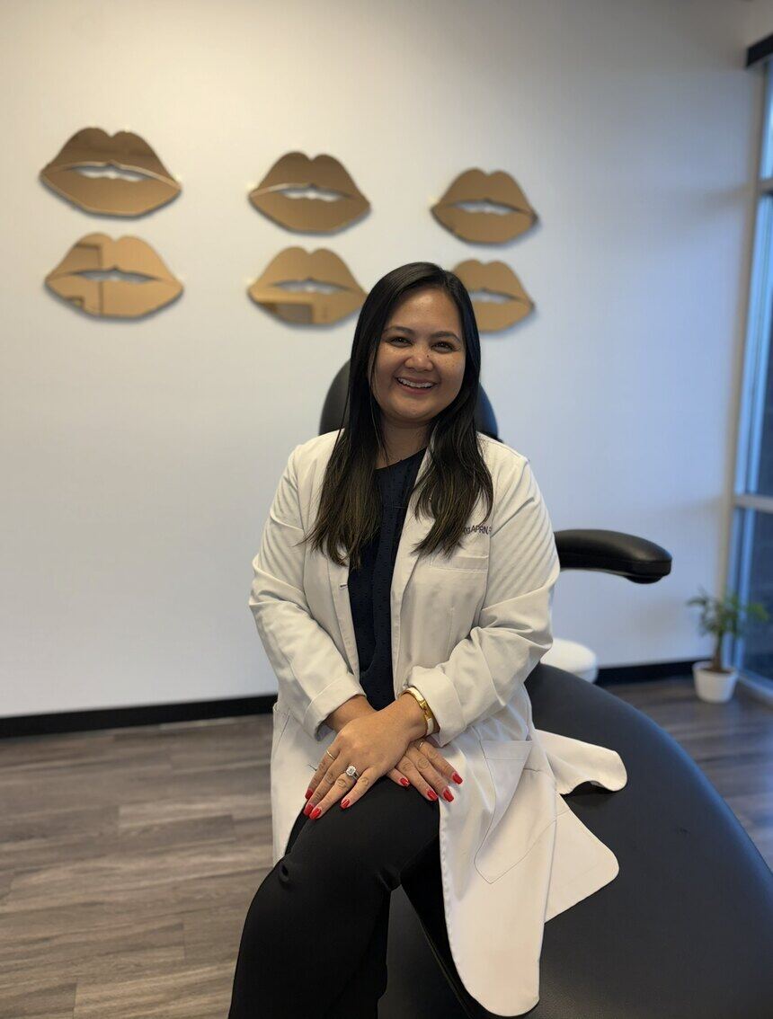 Bianca Camille Fong, APRN, FNP-BC, owner of Blanqa Medspa, seated in the treatment room.